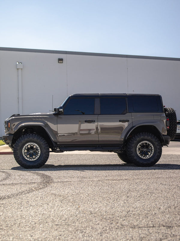 Side profile of a gray Ford Bronco Raptor with Fuel Off-Road wheels and Nitto Trail Grappler tires, built by Empire Motorsports & LINE-X in Rancho Cucamonga