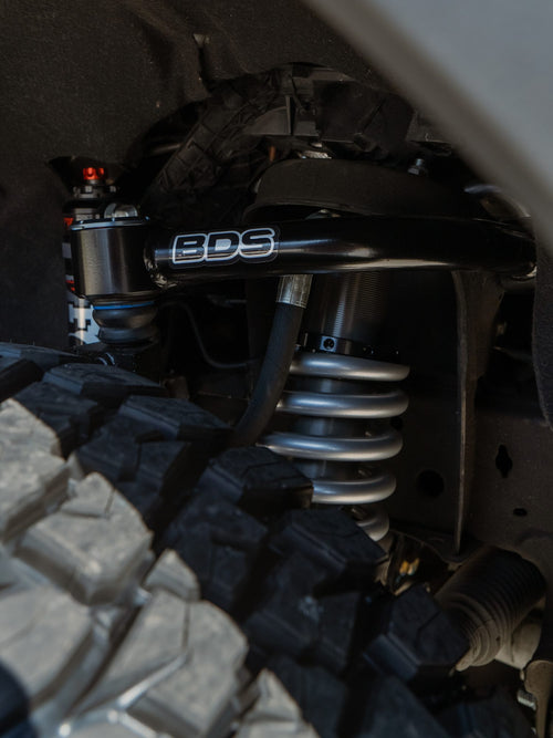 BDS upper control arm and Fox coilover shock on a lifted GMC Sierra 1500