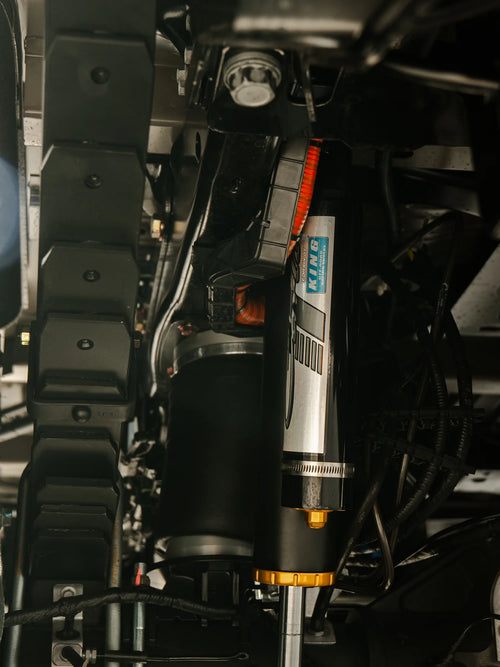 Close-up of the King remote-reservoir shock on the Carli Suspension lift