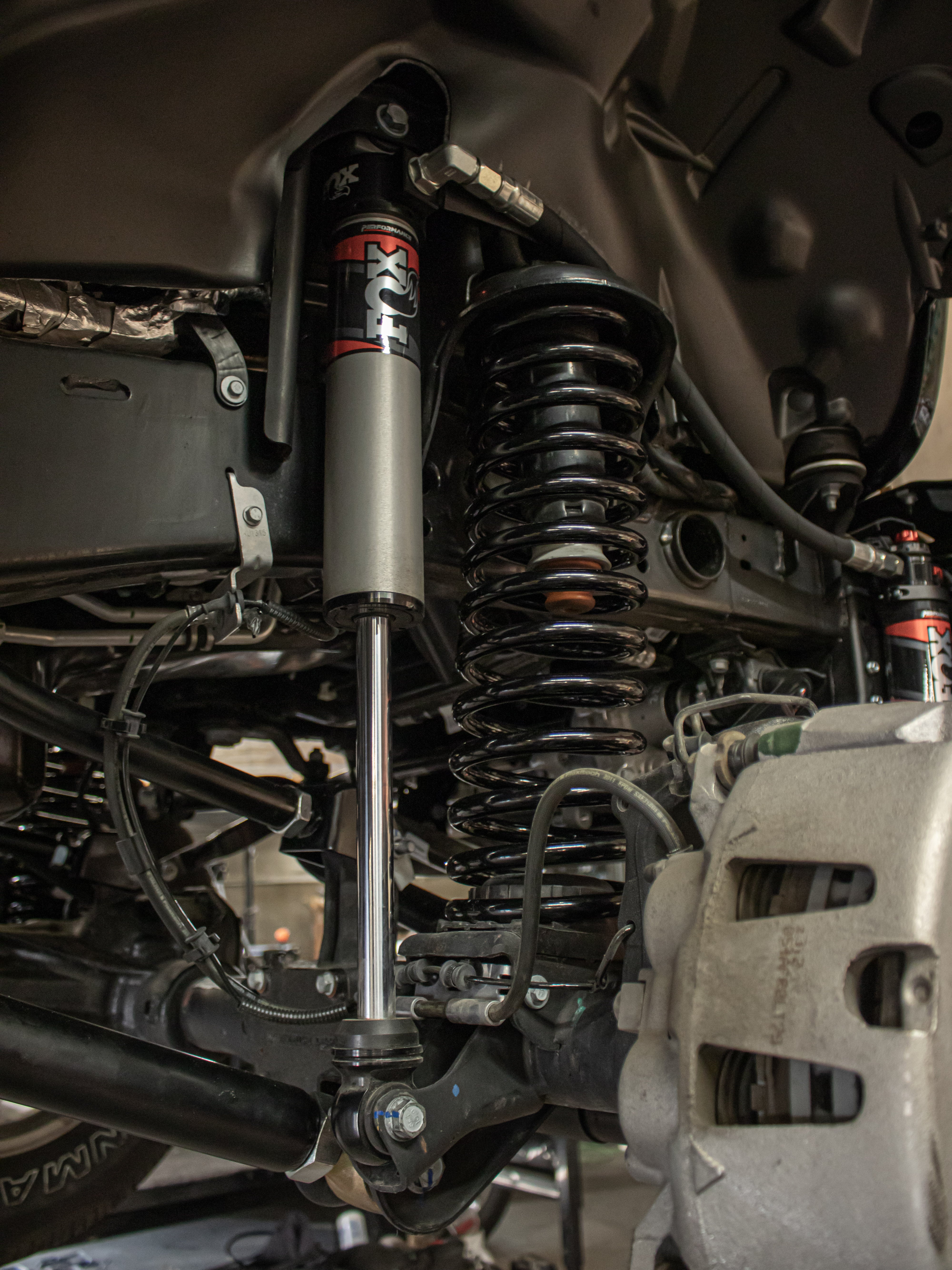 Lifted truck equipped with an aftermarket suspension system