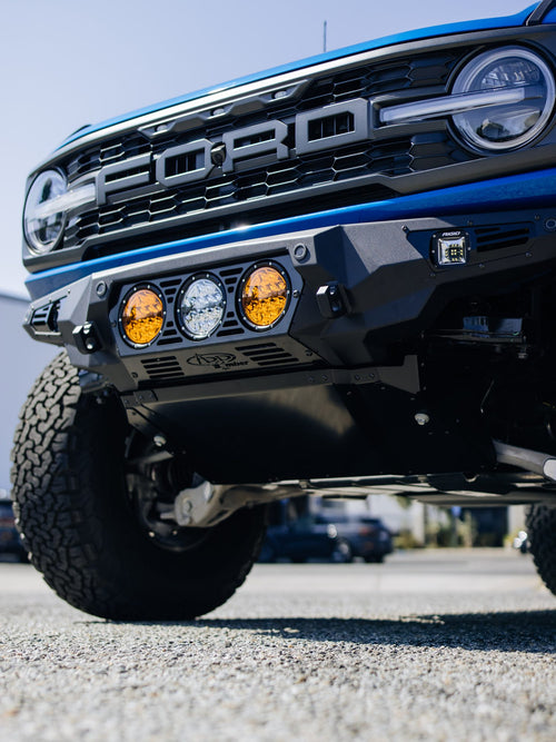 ADD Offroad logo on the custom front bumper of a blue Ford Bronco Raptor
