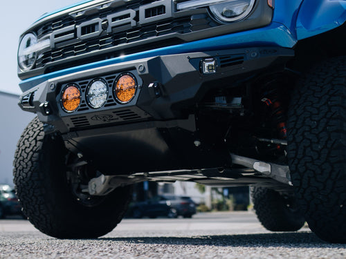 Underside view of a custom front bumper with amber lights on a Ford Bronco Raptor