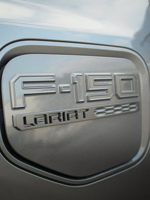 F-150 charge port door on a gray Ford F-150 Lightning