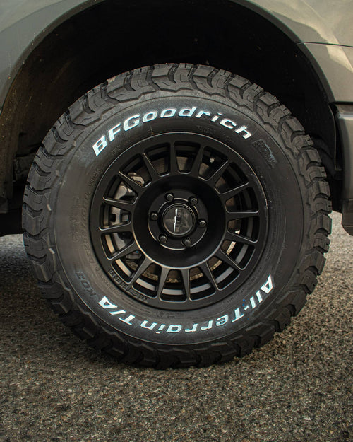 Rear wheel and BFGoodrich all-terrain tire on a gray Ford F-150 Lightning