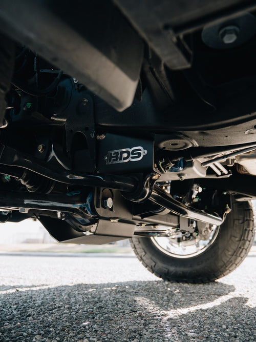 BDS suspension components visible under a lifted silver GMC Sierra Denali
