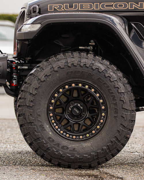 RUBICON lettering on the fender above a black wheel and off-road tire