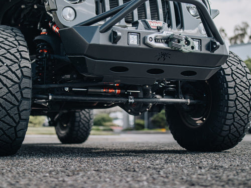 Low angle of the front winch bumper on a lifted Jeep Wrangler Rubicon