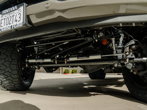 King off-road racing shocks on the F-450's rear axle, underside view