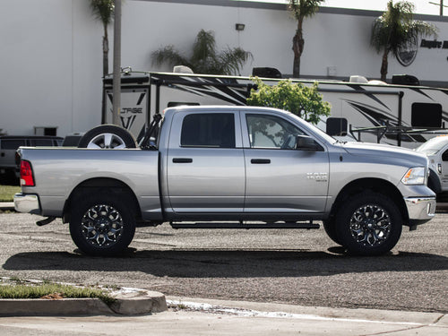 Side profile of a silver RAM 1500 crew cab
